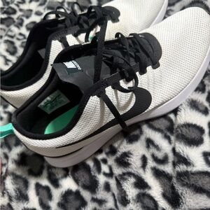 Nike men’s White and Black Sneakers